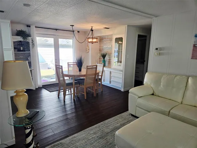 a kitchen with a refrigerator and a stove top oven