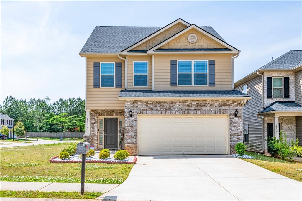 a front view of a house with garden