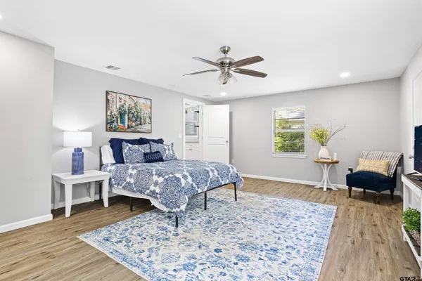 a living room with furniture and a rug