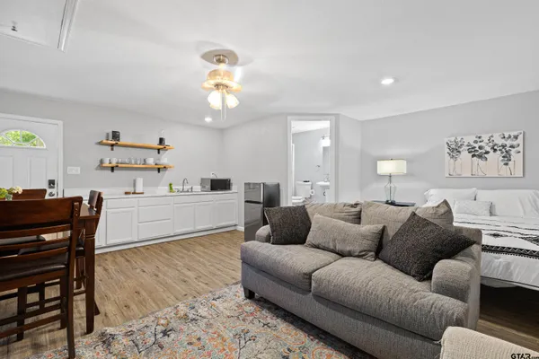 a living room with furniture or couch and a dining table