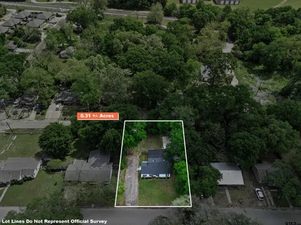 an aerial view of residential house with outdoor space