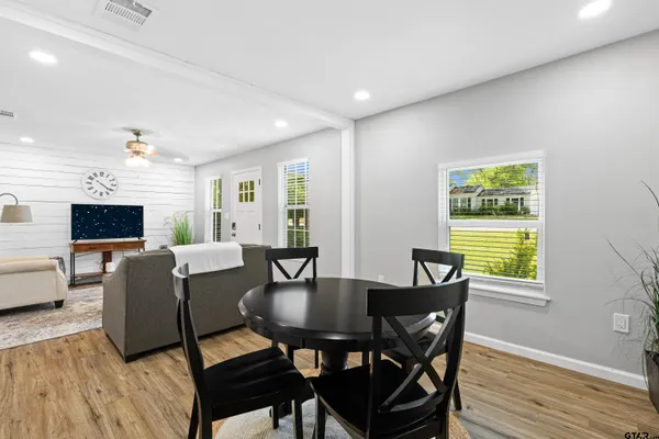 a view of a dining room with furniture window and wooden floor