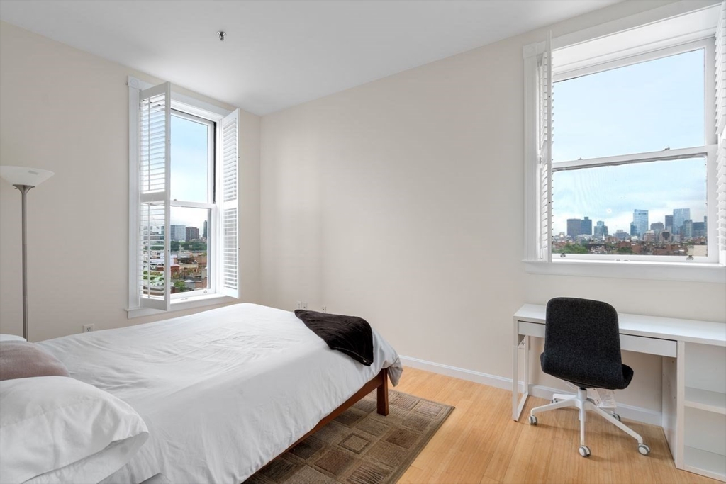 416 Marlborough Street, Unit 501 Boston, MA 02115 - Photo 2 of 12 a bedroom with a bed and a window