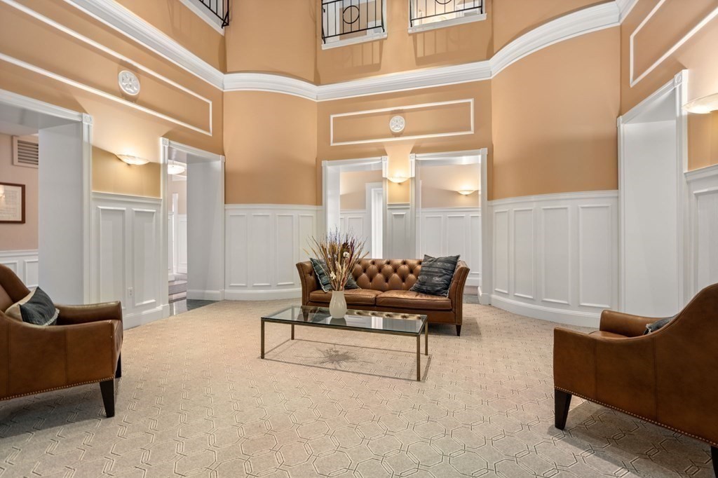 416 Marlborough Street, Unit 501 Boston, MA 02115 - Photo 4 of 12 a living room with furniture and a potted plant