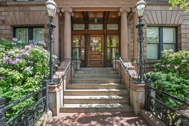 a front view of a house with a porch