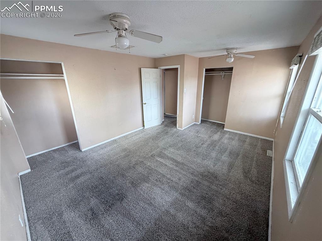 38 Macalester Road Pueblo, CO 81001 - Photo 4 of 15 a view of empty room with ceiling fan