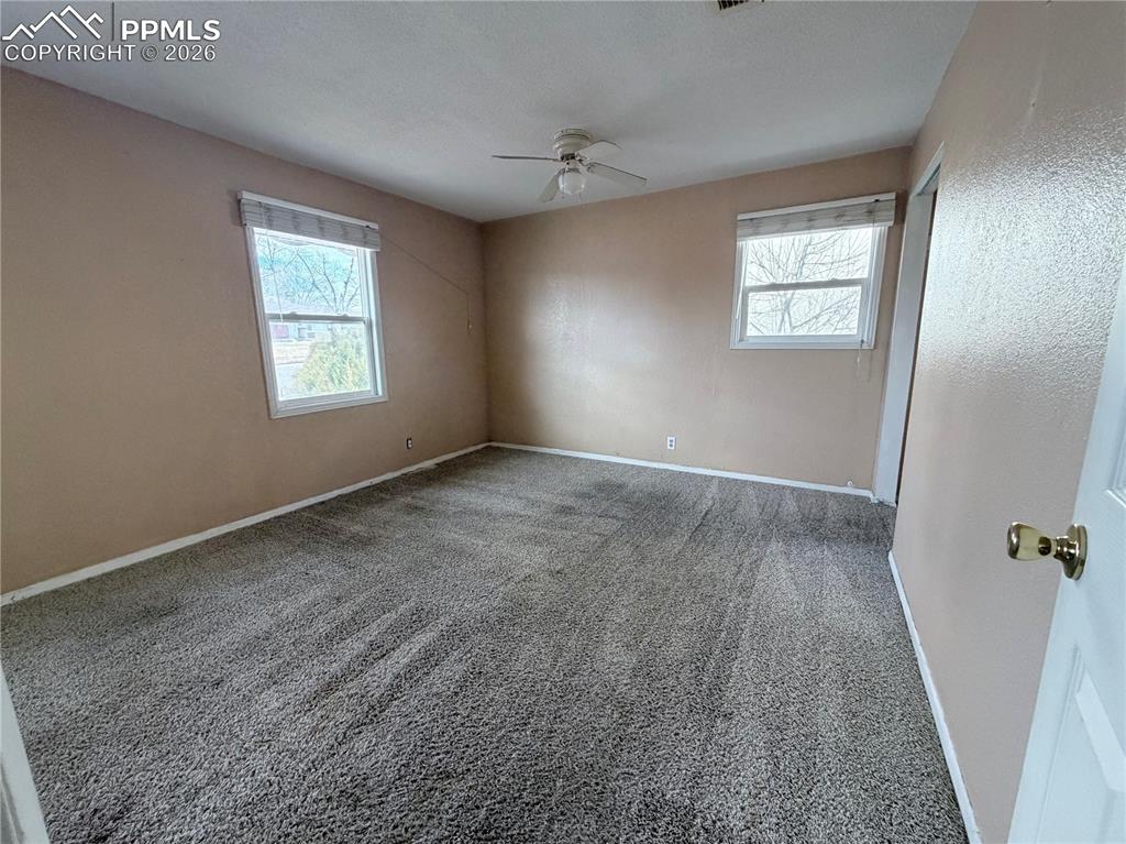 38 Macalester Road Pueblo, CO 81001 - Photo 5 of 15 a view of an empty room with a window