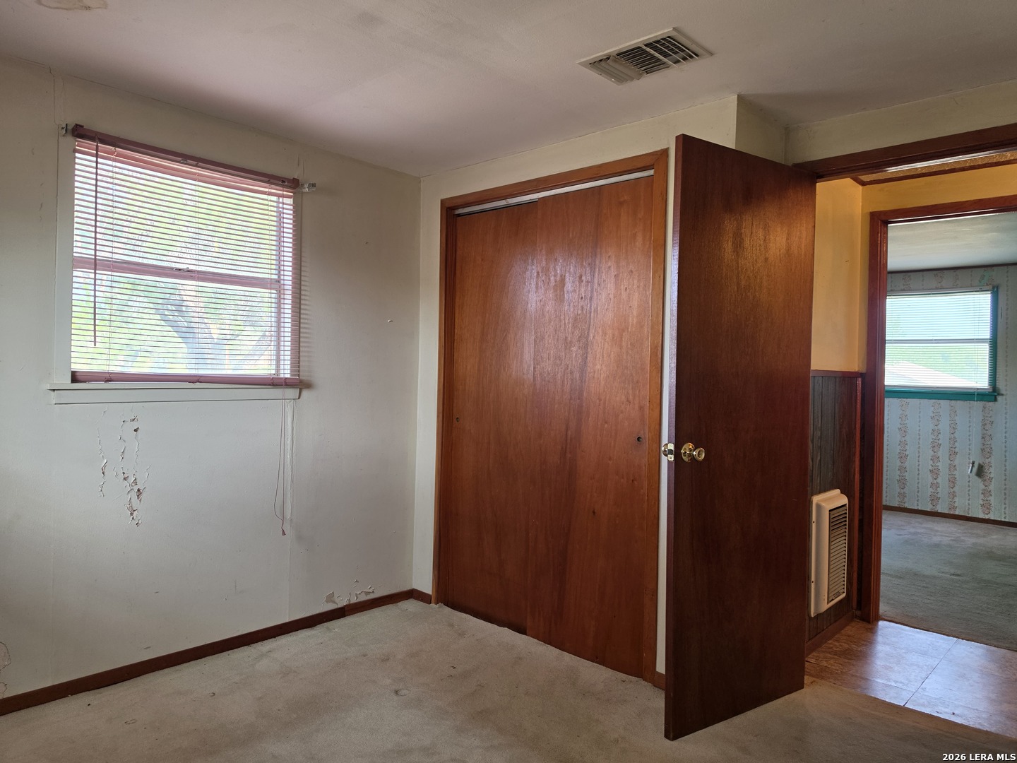 508 Nueces Cotulla, TX 78014 - Photo 10 of 14 an empty room with windows