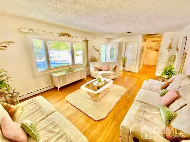 30 Main Street East Brunswick, NJ 08816 - Photo 11 of 40 a living room with furniture and a large window