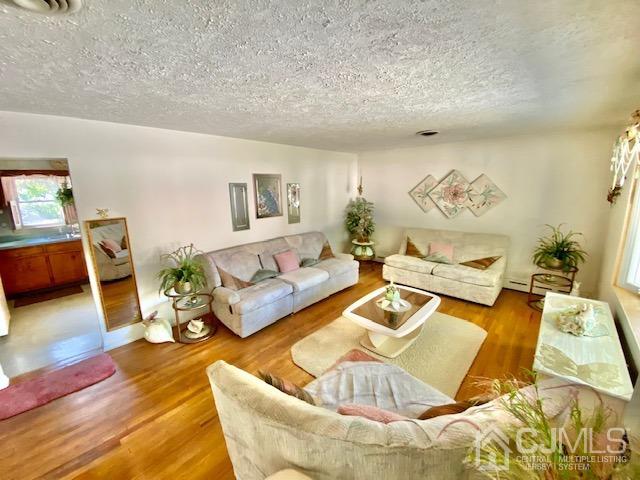 30 Main Street East Brunswick, NJ 08816 - Photo 12 of 40 a living room with furniture and a rug
