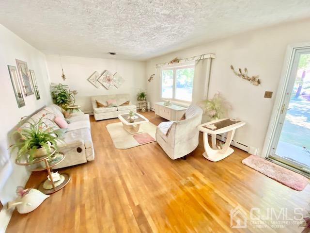 30 Main Street East Brunswick, NJ 08816 - Photo 13 of 40 a living room with furniture and a table