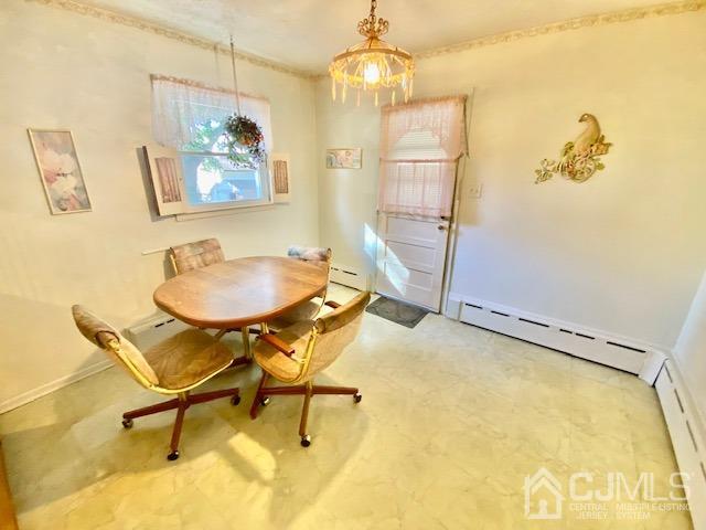 30 Main Street East Brunswick, NJ 08816 - Photo 15 of 40 a dining room with chandelier and a dining table