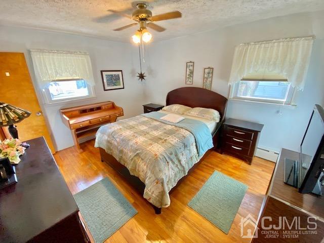 30 Main Street East Brunswick, NJ 08816 - Photo 20 of 40 a bedroom with bed and window