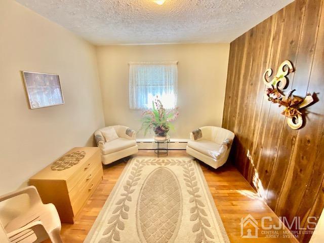 30 Main Street East Brunswick, NJ 08816 - Photo 27 of 40 a spacious bedroom with a bed and couch
