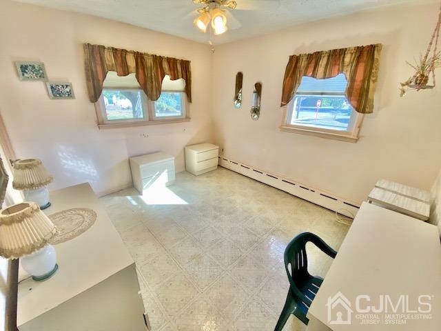 30 Main Street East Brunswick, NJ 08816 - Photo 29 of 40 a view of a bedroom with a bed and couch