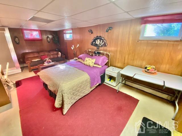 30 Main Street East Brunswick, NJ 08816 - Photo 32 of 40 a bedroom with a bed and a flat screen tv