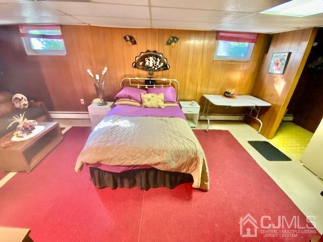 30 Main Street East Brunswick, NJ 08816 - Photo 33 of 40 a bedroom with a bed and a table with painted walls