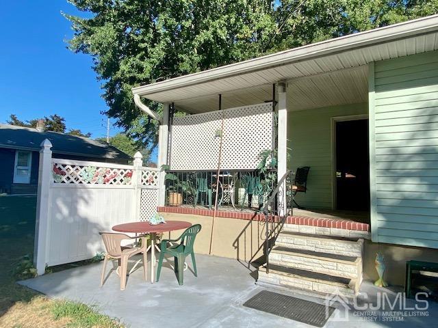 30 Main Street East Brunswick, NJ 08816 - Photo 8 of 40 a patio with table and chairs