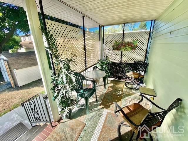 30 Main Street East Brunswick, NJ 08816 - Photo 10 of 40 a balcony with table and chairs