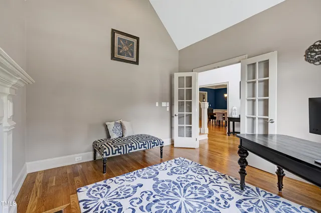 a kitchen with granite countertop kitchen island stainless steel appliances a sink stove and refrigerator