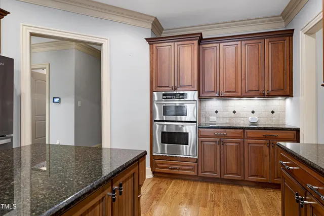 a spacious bedroom with a bed and ceiling fan