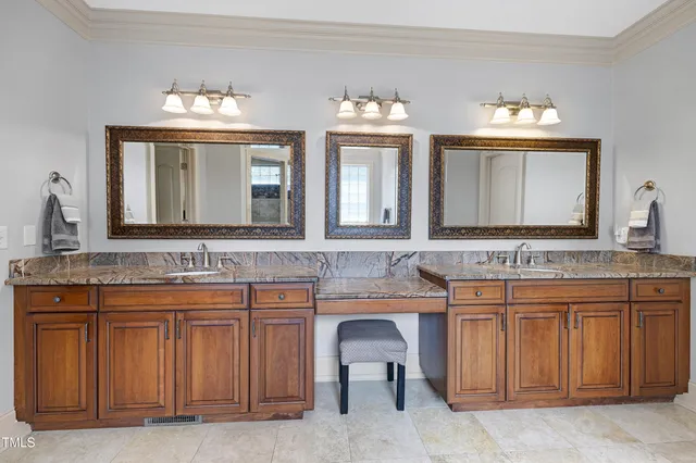 a bedroom with a large bed and a flat screen tv