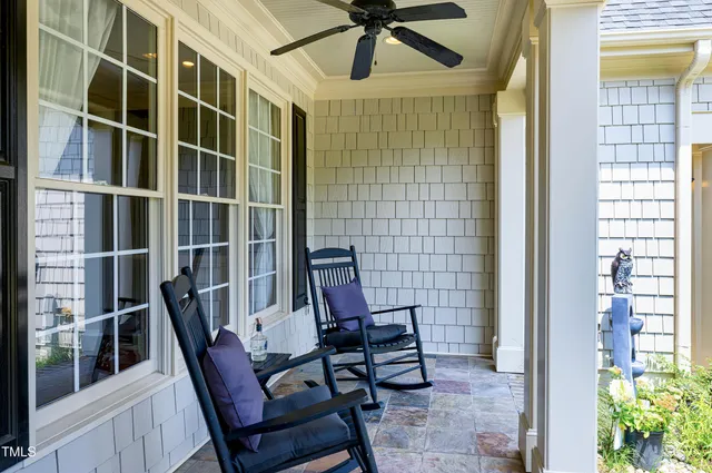 a view of an entryway with wooden floor and door