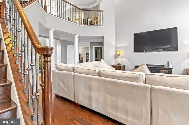 a kitchen with stainless steel appliances granite countertop a stove a sink and a granite counter tops with wooden floors