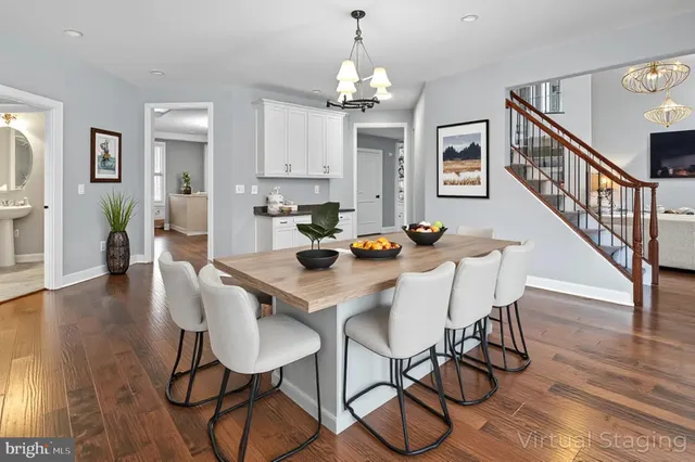 a bathroom with a granite countertop sink a toilet and a mirror