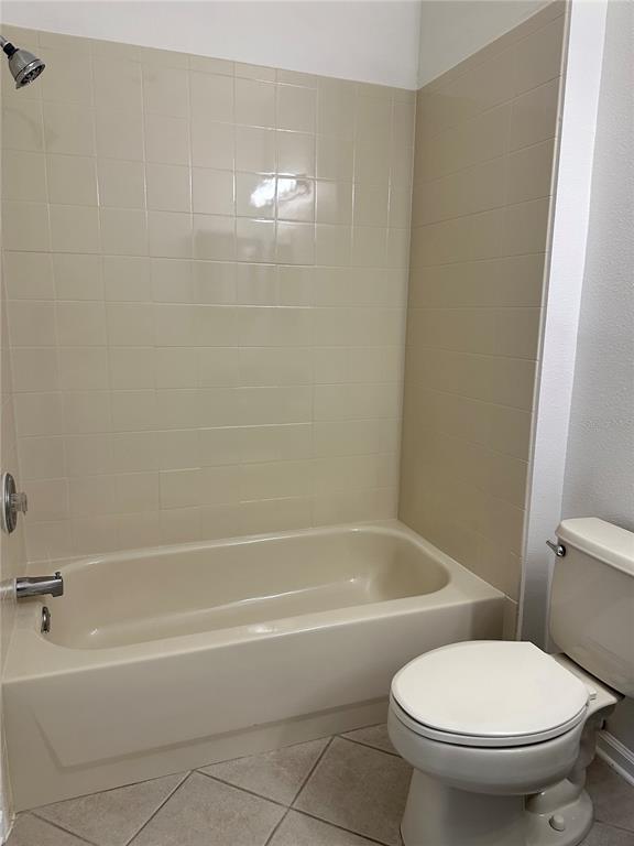 13584 Turtle Marsh Loop, Unit 132 Orlando, FL 32837 - Photo 14 of 21 a white toilet sitting next to a bath tub