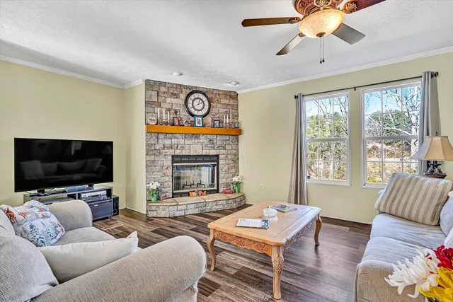 a view of a dining room with furniture wooden floor and chandelier