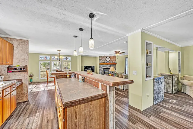 a bedroom with a bed wooden floor and lamp