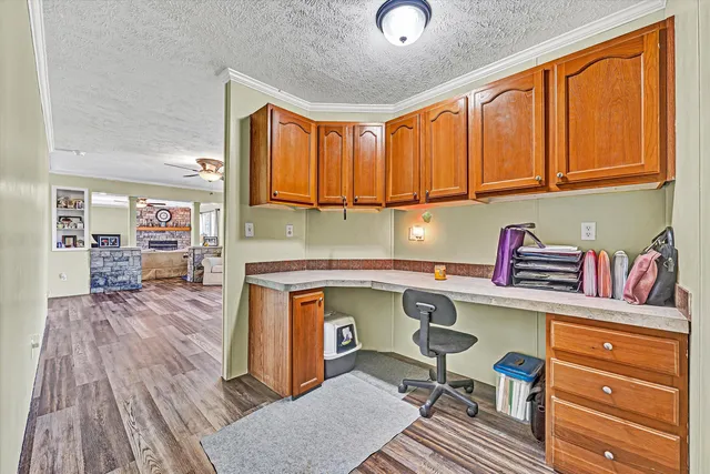 a workspace with furniture and a window