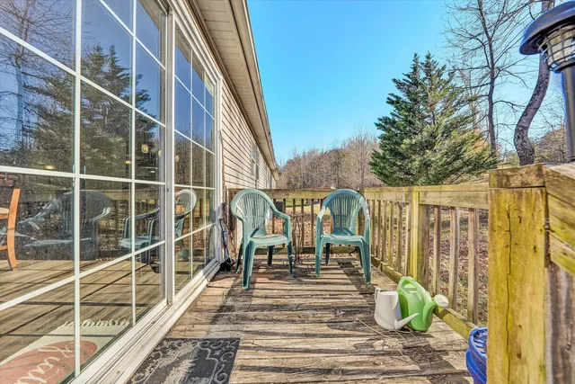 a view of yard covered with snow in front of house