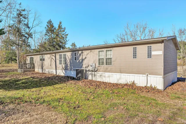 a swimming pool view with trees in the background