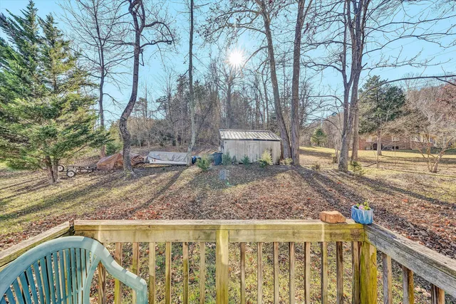 a view of a backyard with wooden fence