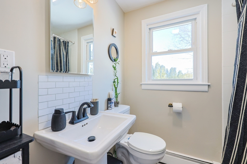 158 Chester Street Worcester, MA 01605 - Photo 14 of 42 a bathroom with a sink a toilet and a mirror