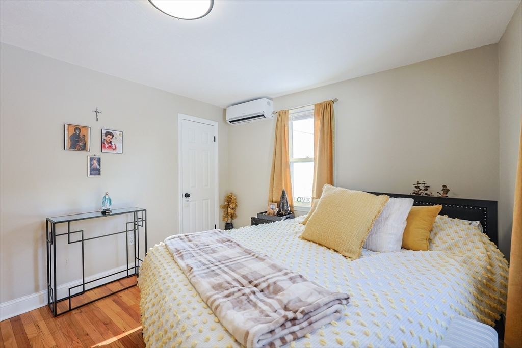 158 Chester Street Worcester, MA 01605 - Photo 17 of 42 a bedroom with a bed and a window