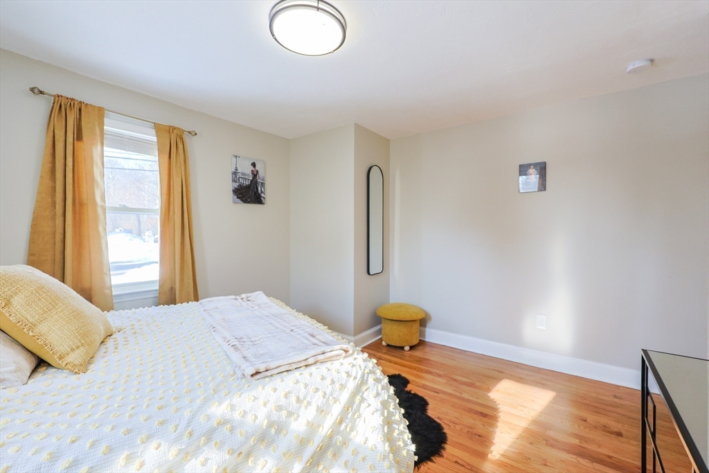 158 Chester Street Worcester, MA 01605 - Photo 18 of 42 a bedroom with a bed and a window