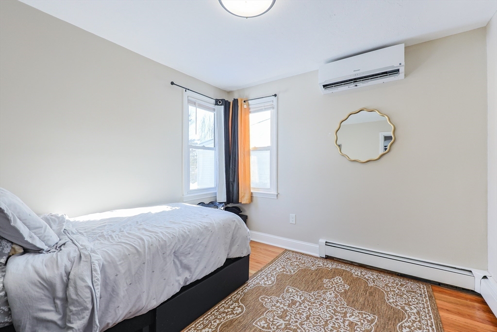 158 Chester Street Worcester, MA 01605 - Photo 19 of 42 a bedroom with a bed and window