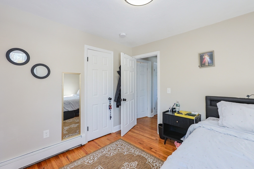 158 Chester Street Worcester, MA 01605 - Photo 20 of 42 a bedroom with bed and a window