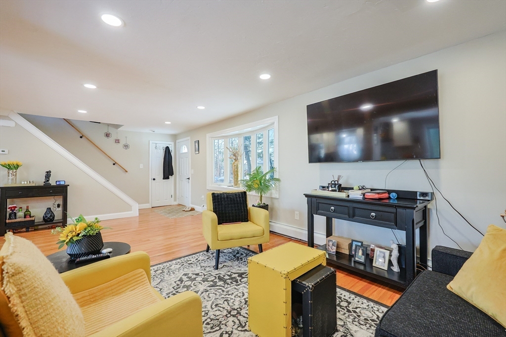 158 Chester Street Worcester, MA 01605 - Photo 2 of 42 a living room with furniture and a flat screen tv