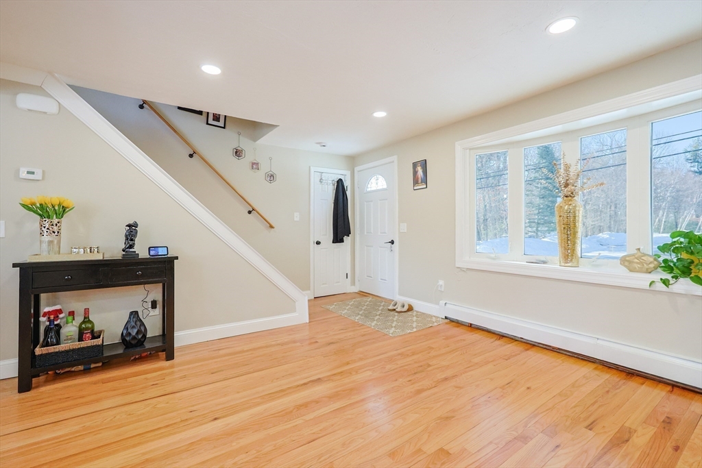 158 Chester Street Worcester, MA 01605 - Photo 21 of 42 a view of an empty room with wooden floor and a window