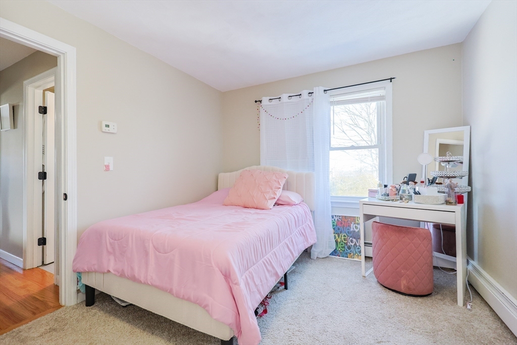 158 Chester Street Worcester, MA 01605 - Photo 26 of 42 a bedroom with a bed and a dresser