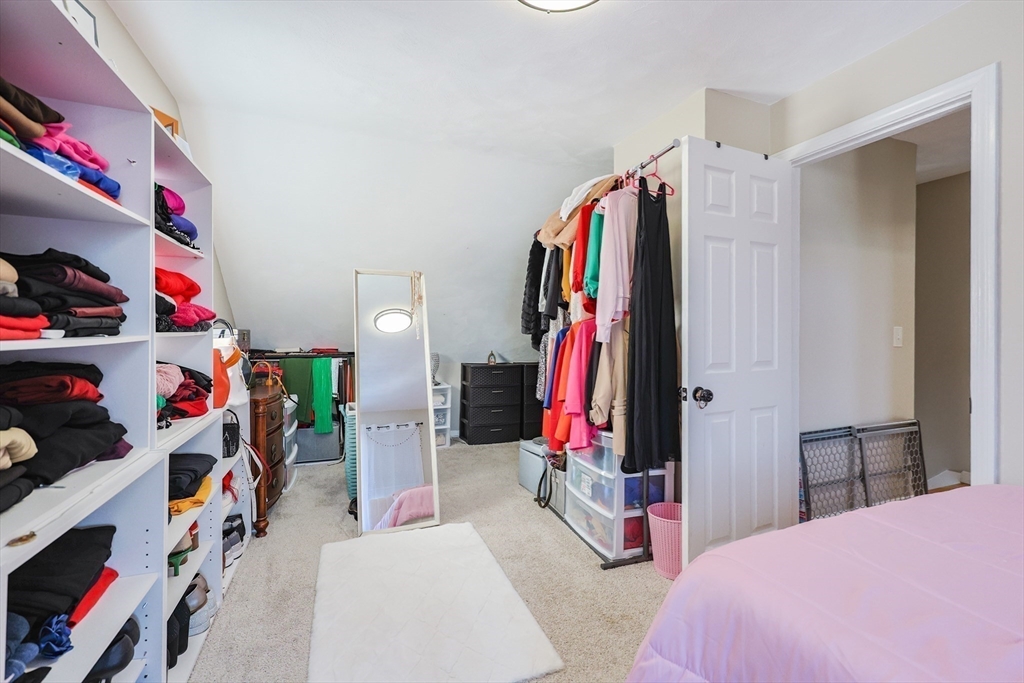 158 Chester Street Worcester, MA 01605 - Photo 27 of 42 a view of walk in closet with clothes and shoes