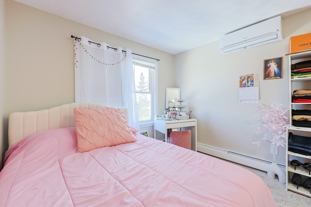 158 Chester Street Worcester, MA 01605 - Photo 28 of 42 a bedroom with a bed and a window