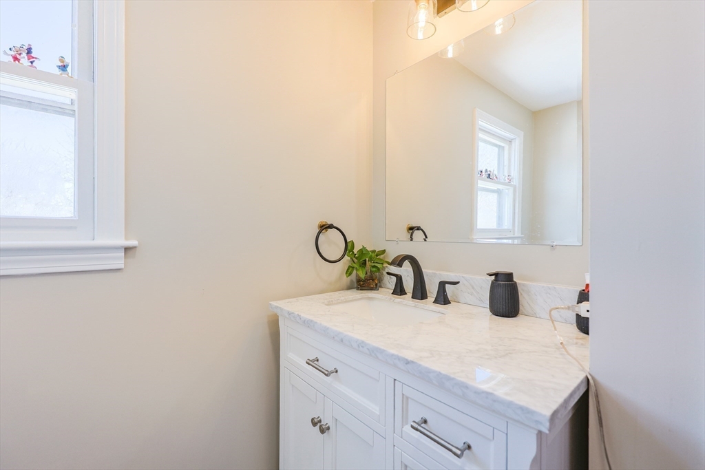 158 Chester Street Worcester, MA 01605 - Photo 30 of 42 a bathroom with a sink and a mirror