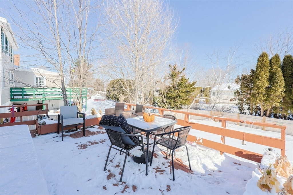 158 Chester Street Worcester, MA 01605 - Photo 40 of 42 a backyard of a house with table and chairs