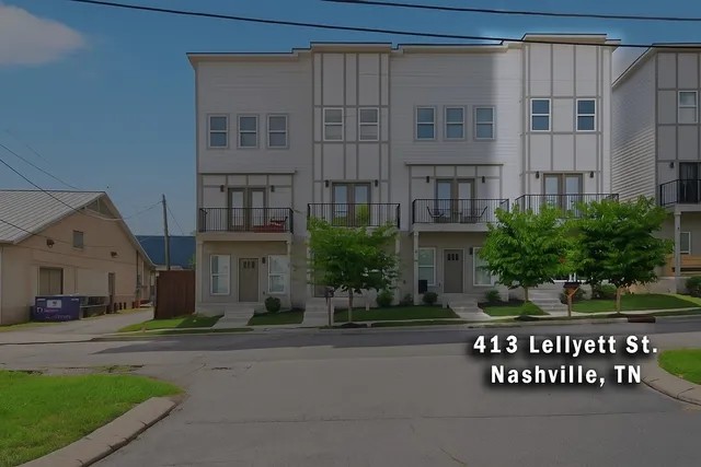 a front view of a building with garden