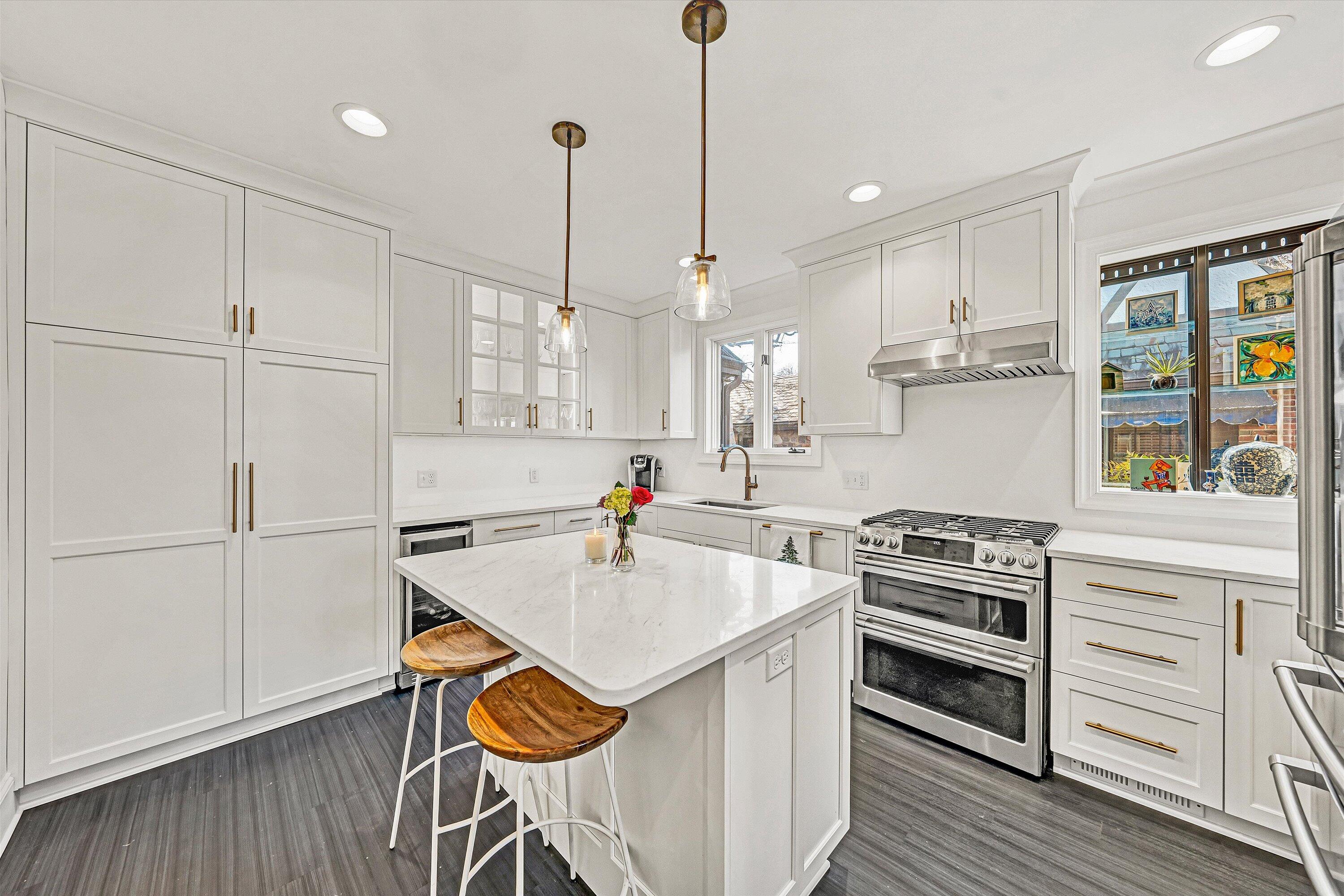 3232 Allendale Street Southwest Roanoke, VA 24014 - Photo 13 of 48 a kitchen with a stove a refrigerator and a wooden floor